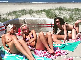 After some surfing four hot, fit babes hook up on the beach